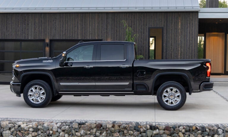 2026 Chevy Silverado 2500 side view outside modern house