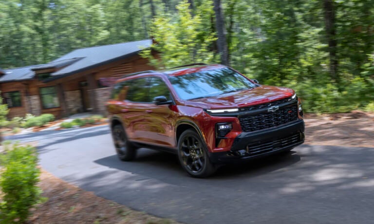 2027 Chevy Traverse driving away from cabin